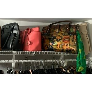 Women’s magazine crossbody PVC bag with middle cross latch. Gentle used.